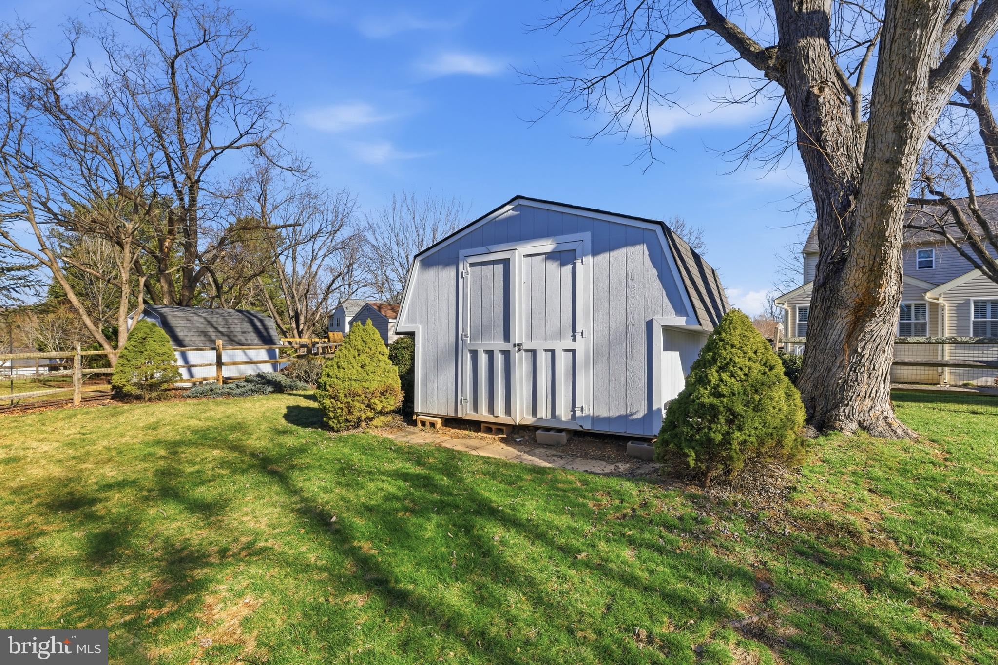 9709 Noble Ridge Terrace Gaithersburg, MD 20882 - Photo 46 of 64 a view of a backyard with a garden