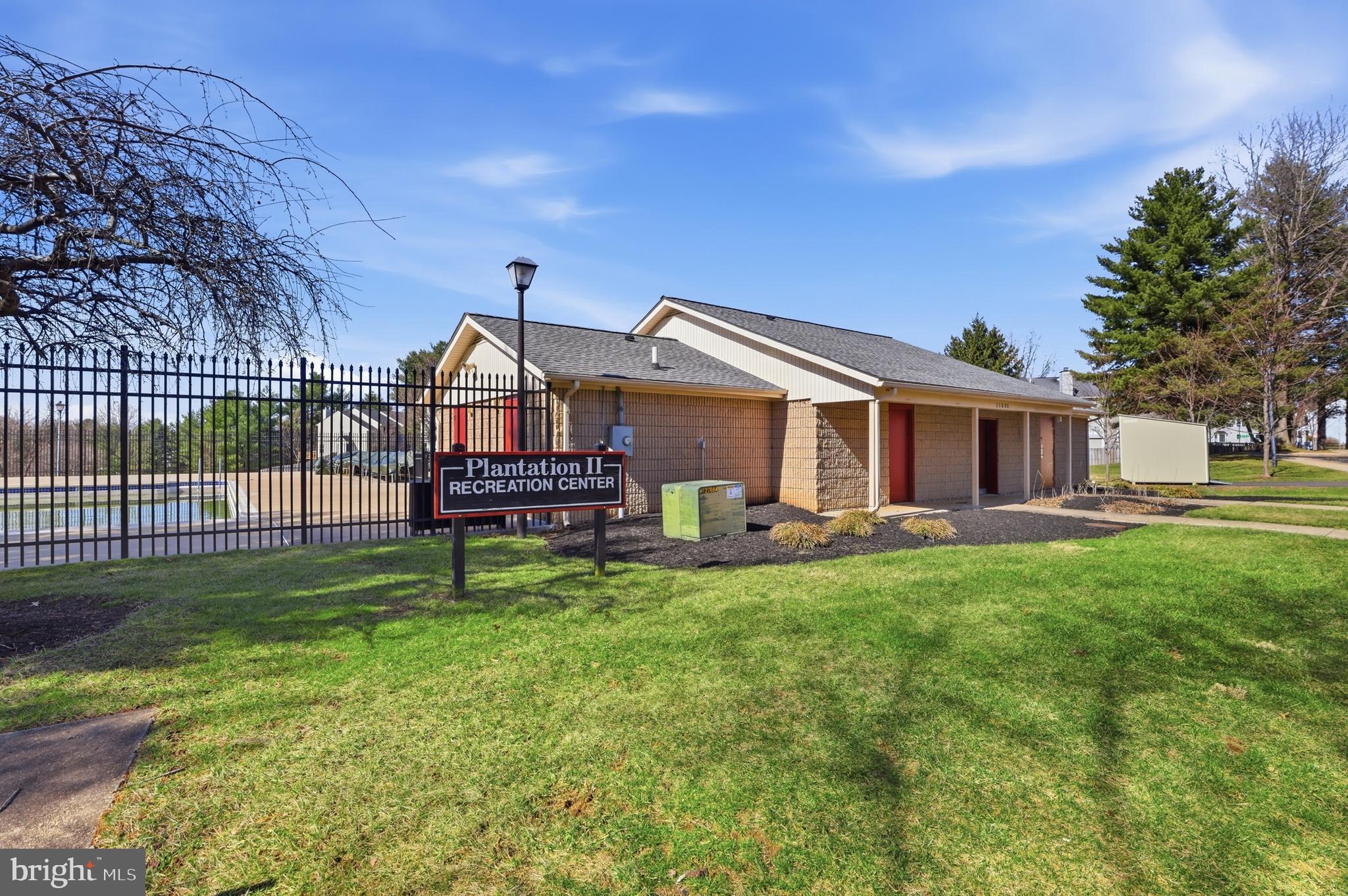9709 Noble Ridge Terrace Gaithersburg, MD 20882 - Photo 56 of 64 a view of a house with backyard and porch