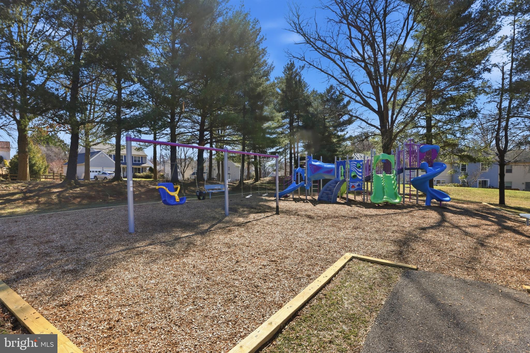 9709 Noble Ridge Terrace Gaithersburg, MD 20882 - Photo 58 of 64 a view of a park with swings