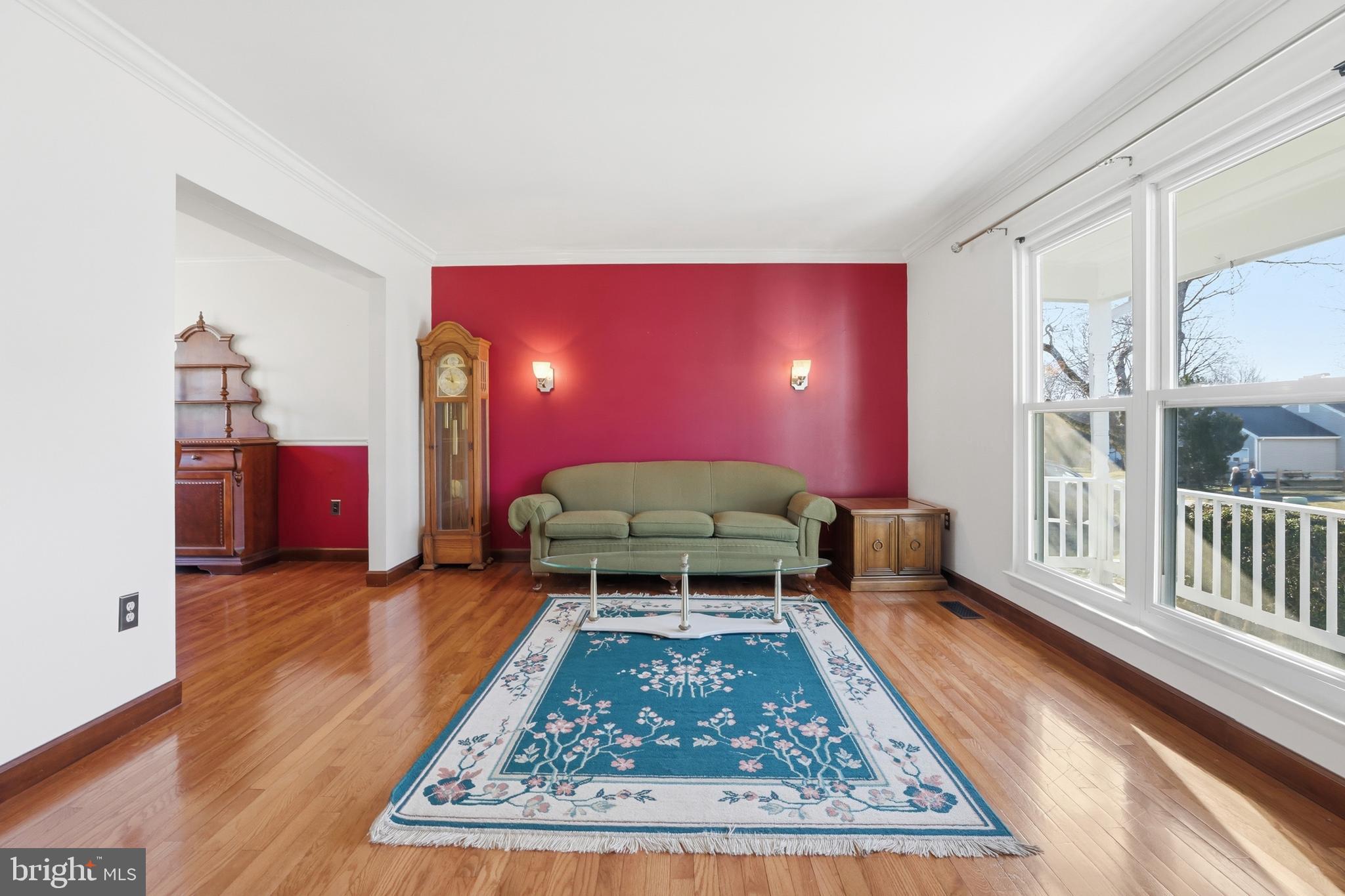 9709 Noble Ridge Terrace Gaithersburg, MD 20882 - Photo 9 of 64 a living room with furniture rug and wooden floor