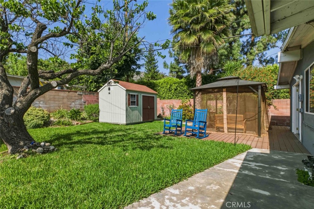 301 West Ashby Street Azusa, CA 91702 - Photo 30 of 75 a front view of a house with a yard and porch