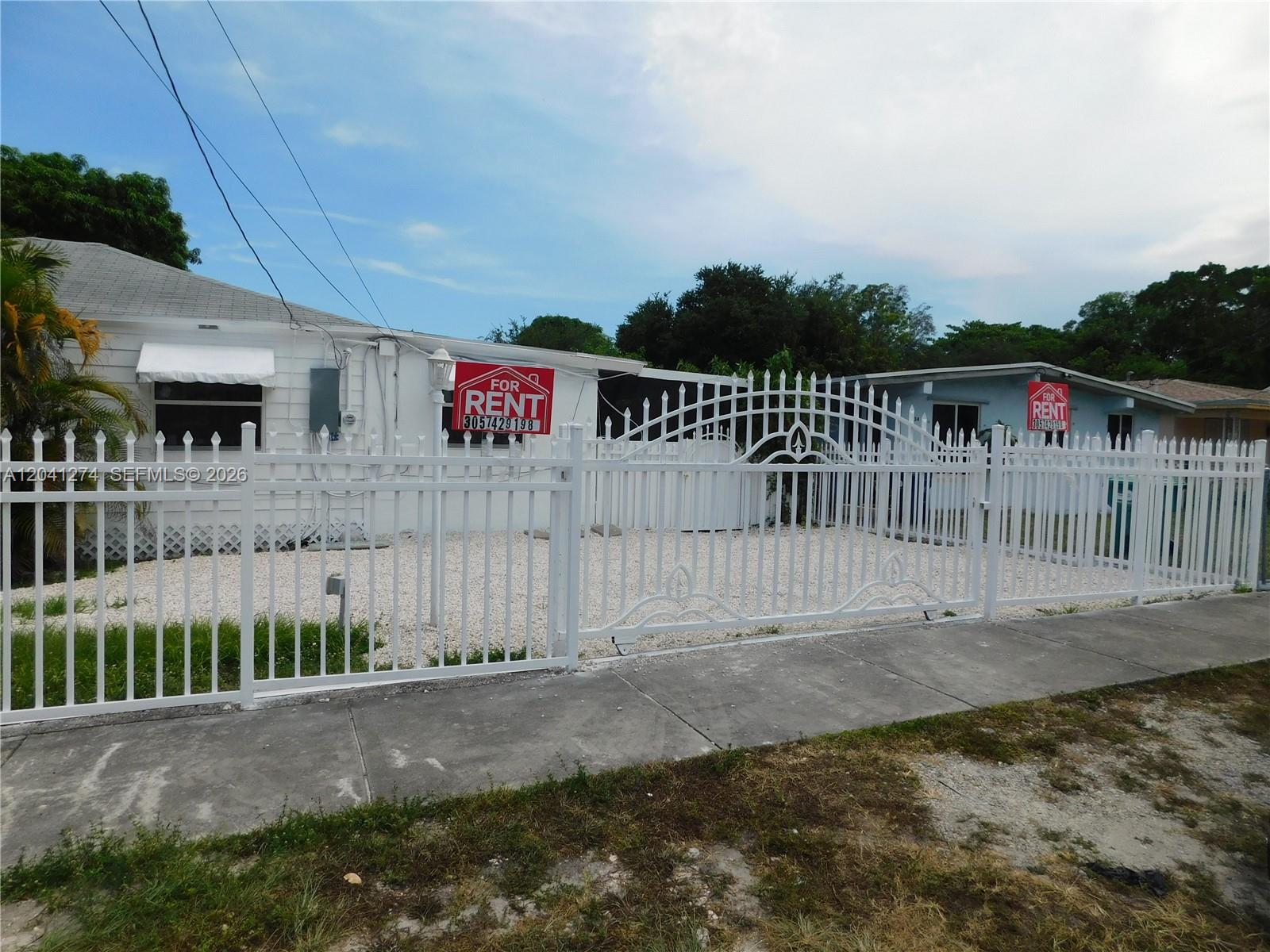 2230 Northwest 58th Street, Unit B Miami, FL 33142 - Photo 2 of 18 a view of a wrought iron fences