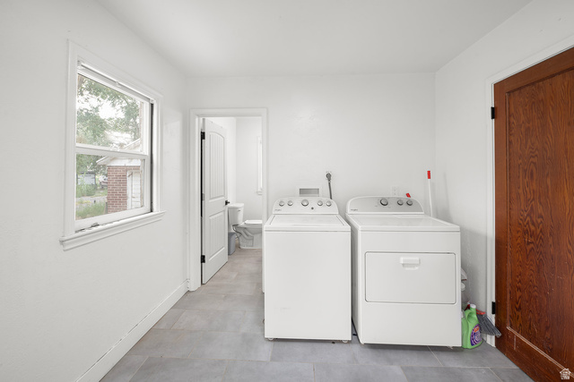 3885 West 4500 S Road Delta, UT 84624 - Photo 19 of 24 Laundry area with tiled flooring, white walls, and a white-framed window