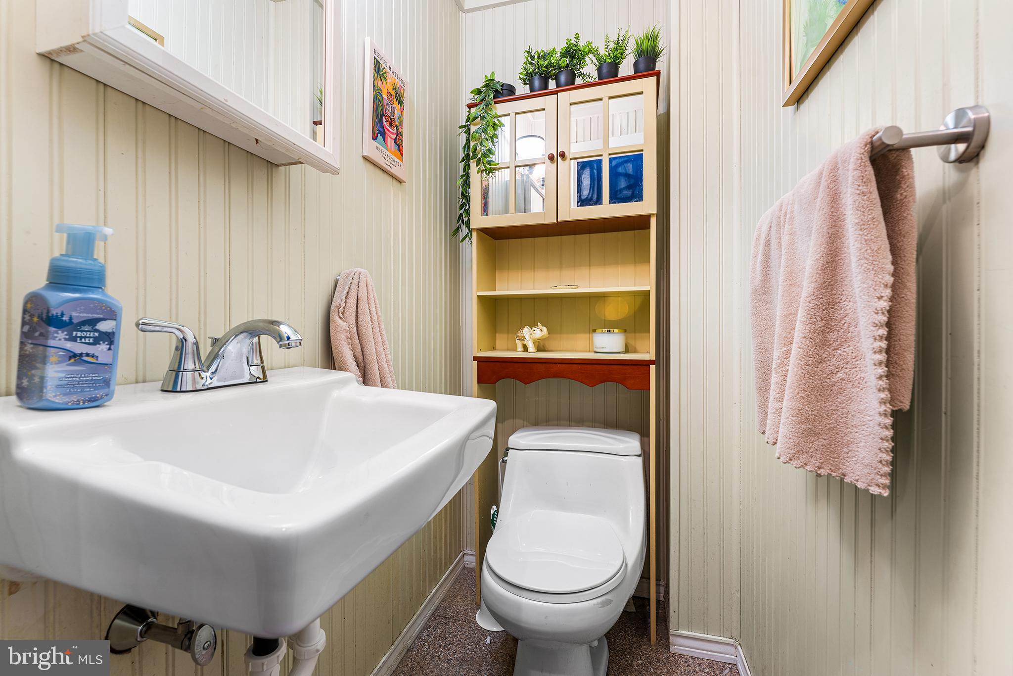 7381 Valley Avenue Philadelphia, PA 19128 - Photo 7 of 14 a bathroom with a sink toilet and a mirror