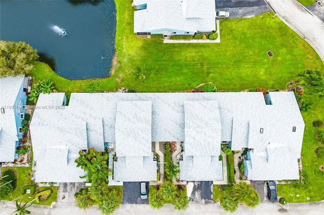 an aerial view of residential house with outdoor space and swimming pool
