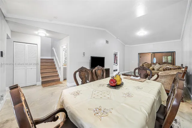 a bedroom with furniture and a flat screen tv