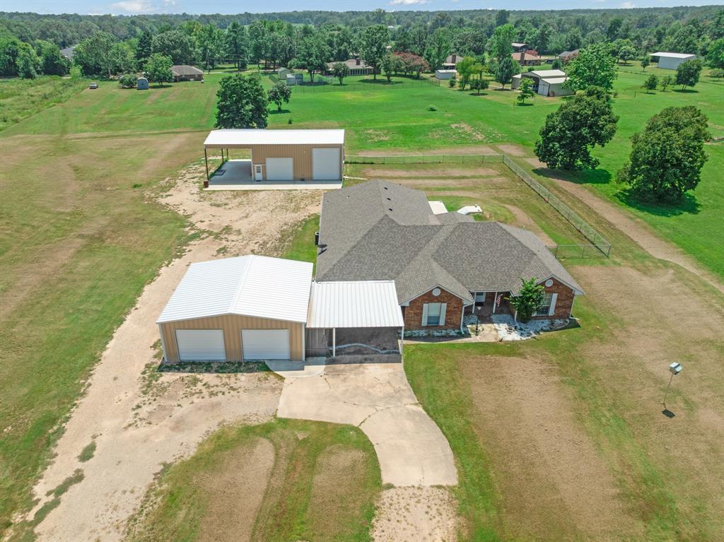 201 Farm To Market 906 Powderly, TX 75473 - Photo 4 of 37 a view of a swimming pool with a yard