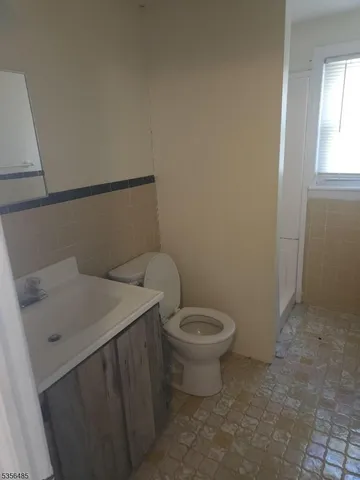 a bathroom with a sink and toilet
