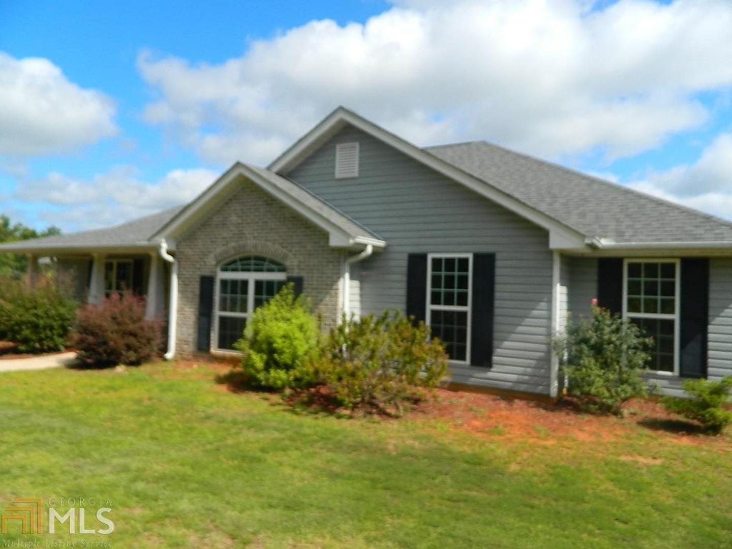 265 Brooks Road Jackson, GA 30233 - Photo 1 of 1 a front view of house with yard and green space