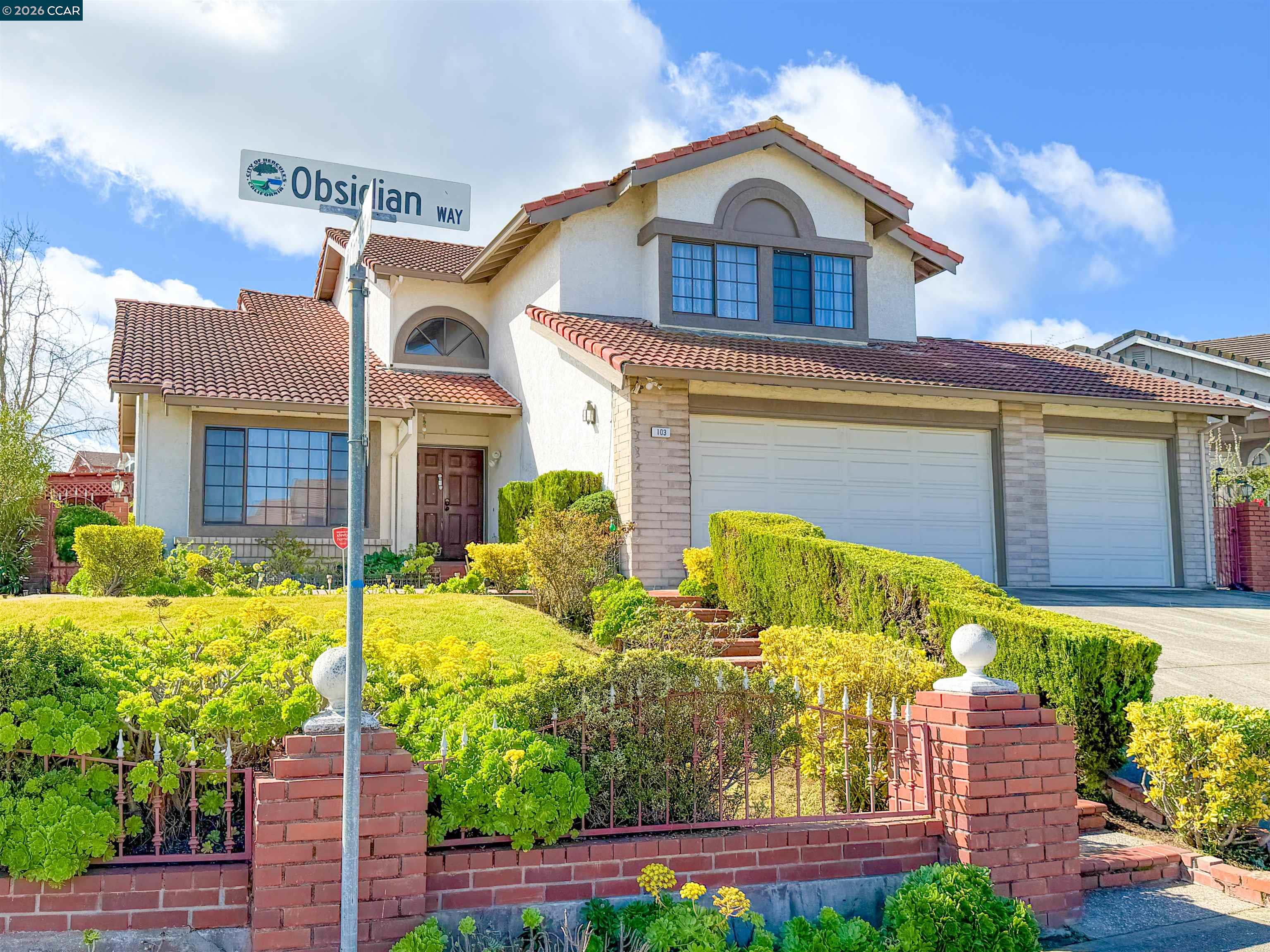 103 Obsidian Way Hercules, CA 94547 - Photo 1 of 7 a front view of a house with garden