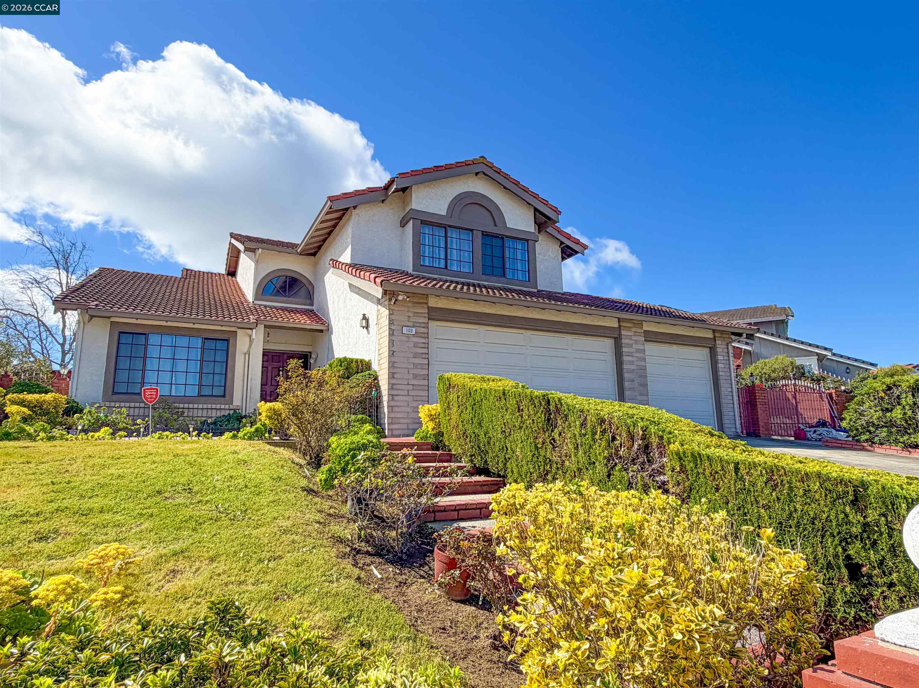 103 Obsidian Way Hercules, CA 94547 - Photo 3 of 7 a view of a house with a big yard plants and large trees