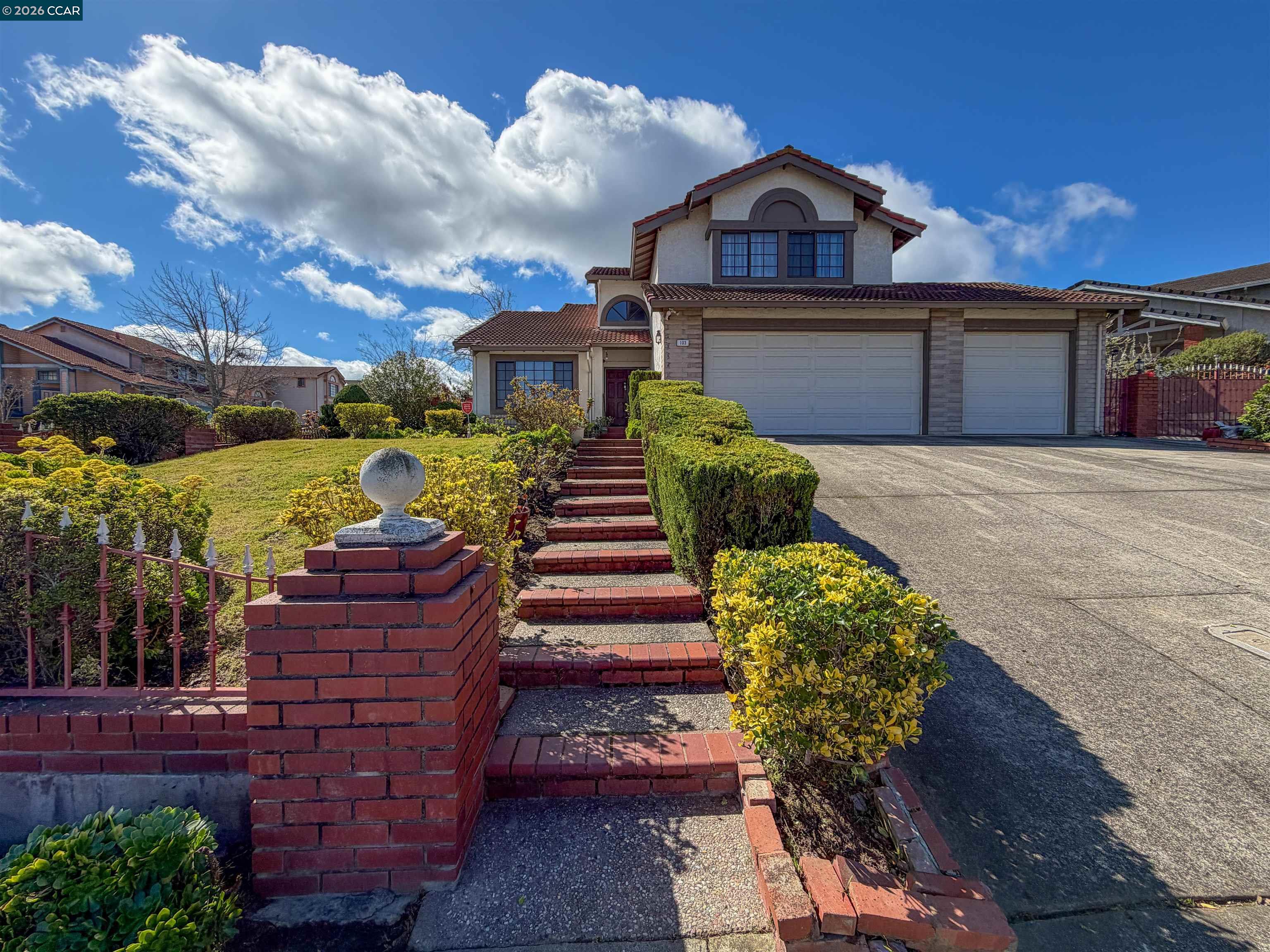 103 Obsidian Way Hercules, CA 94547 - Photo 4 of 7 a front view of a house with a yard