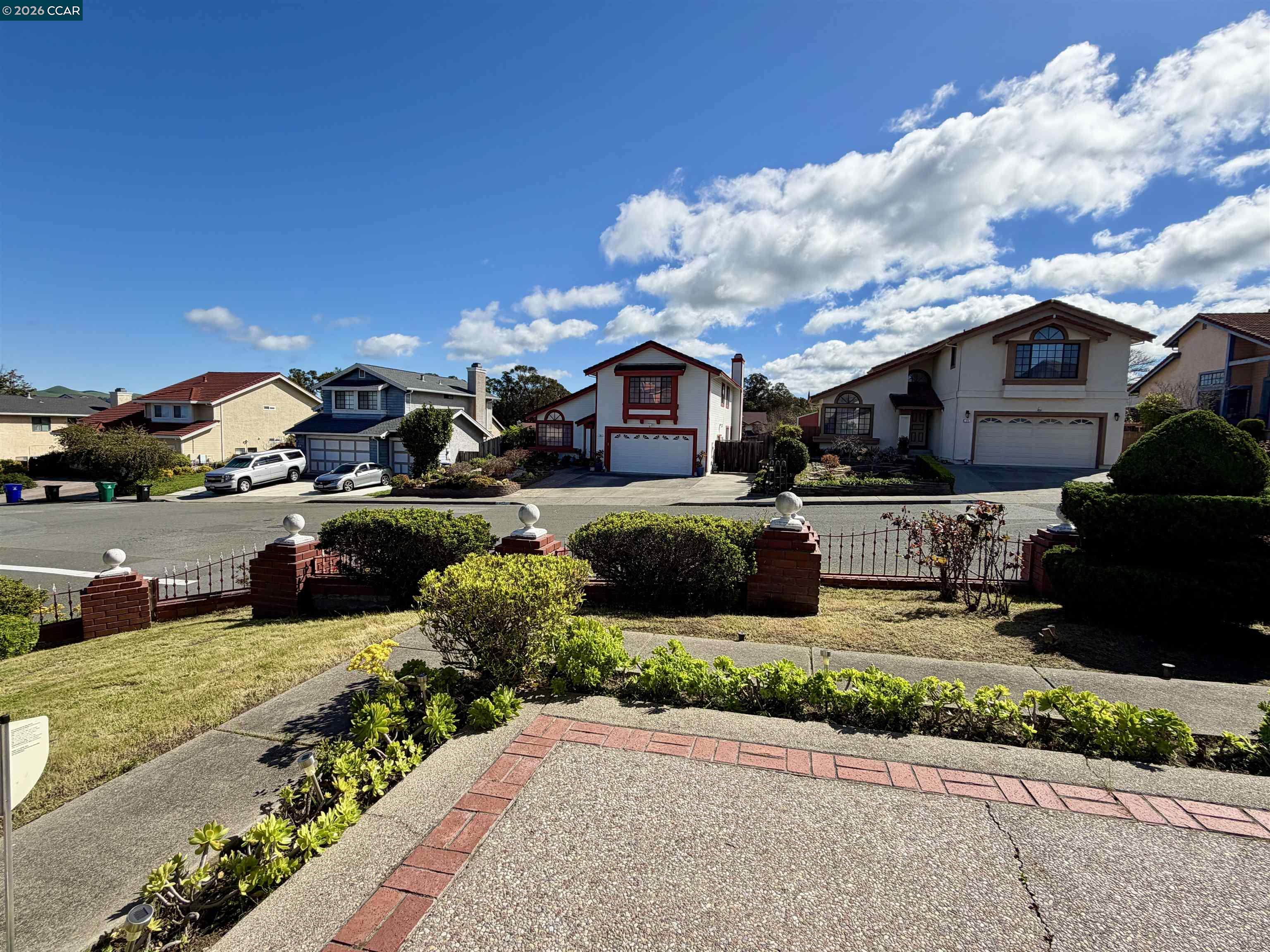 103 Obsidian Way Hercules, CA 94547 - Photo 6 of 7 a front view of a house with garden and porch