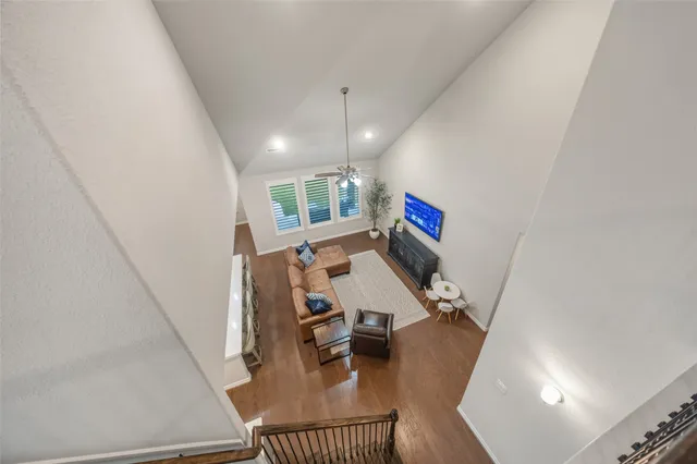 a view of a living room with furniture and a flat screen tv
