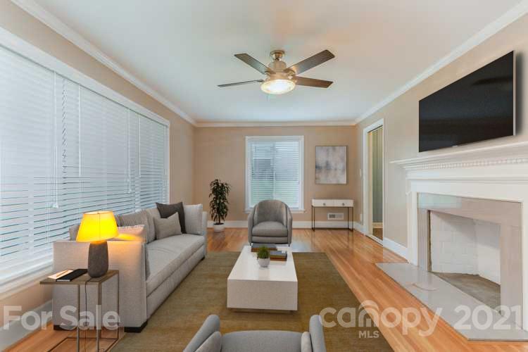 306 Kimmswick Road Charlotte, NC 28214 - Photo 2 of 21 a living room with furniture fireplace and flat screen tv