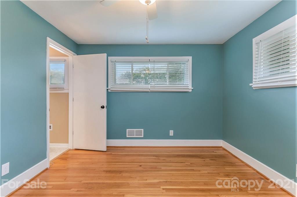 306 Kimmswick Road Charlotte, NC 28214 - Photo 13 of 21 a view of a room with wooden floor and windows