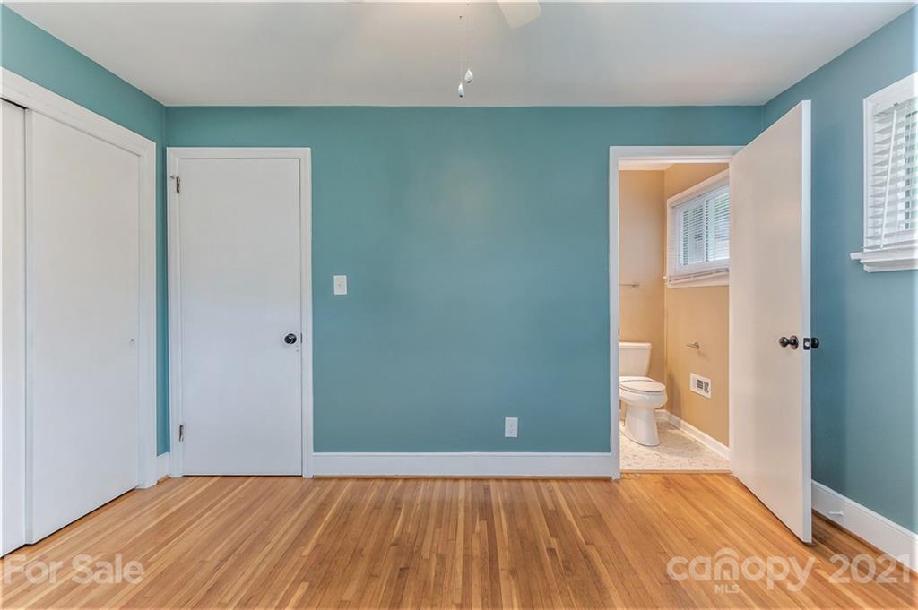 306 Kimmswick Road Charlotte, NC 28214 - Photo 14 of 21 a view of an empty room with wooden floor and a window