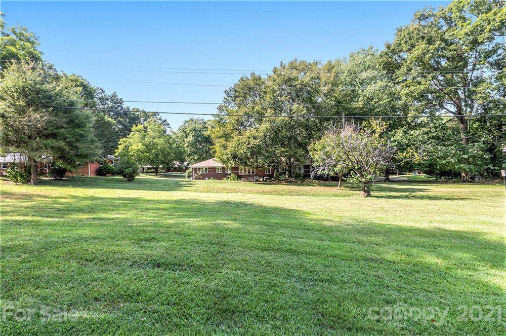 306 Kimmswick Road Charlotte, NC 28214 - Photo 18 of 21 a view of swimming pool is middle in the garden