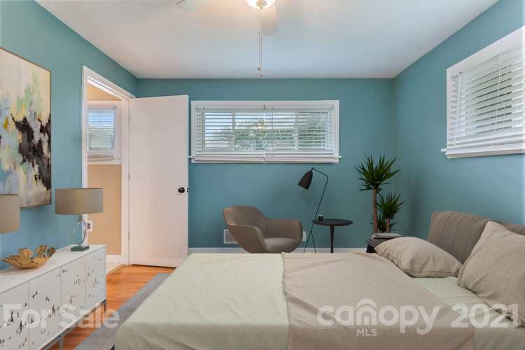 306 Kimmswick Road Charlotte, NC 28214 - Photo 3 of 21 a bedroom with a bed potted plant and a window