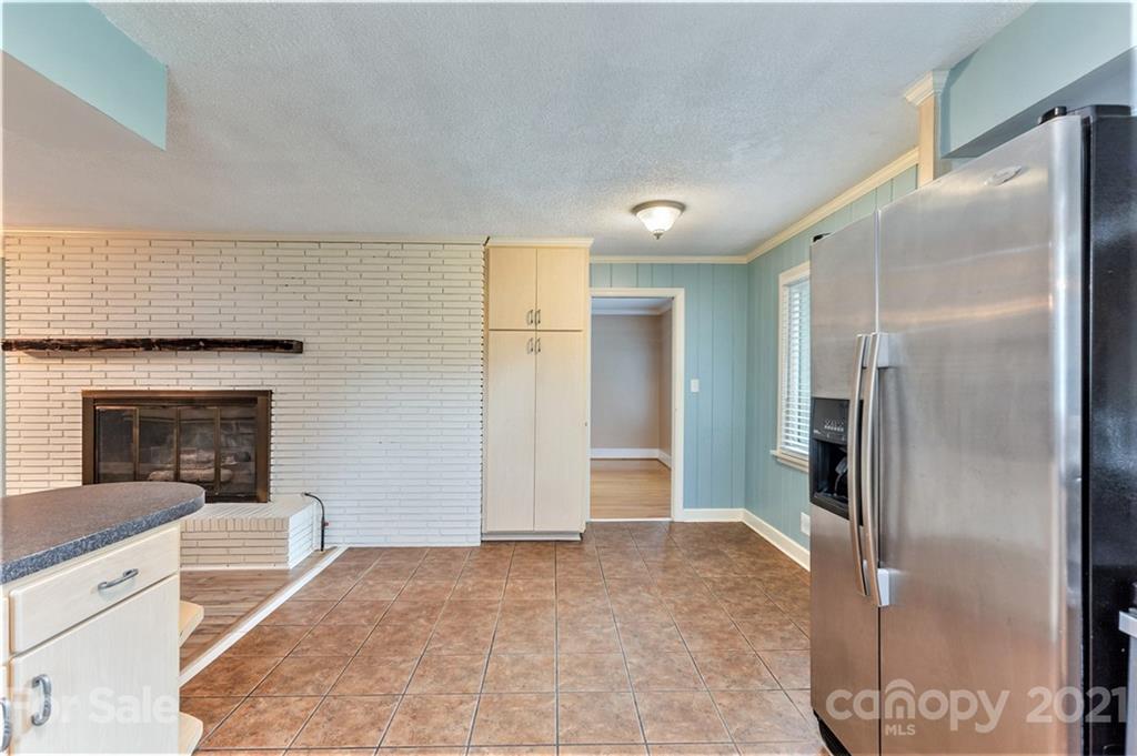 306 Kimmswick Road Charlotte, NC 28214 - Photo 7 of 21 a view of a kitchen cabinets and wooden floor