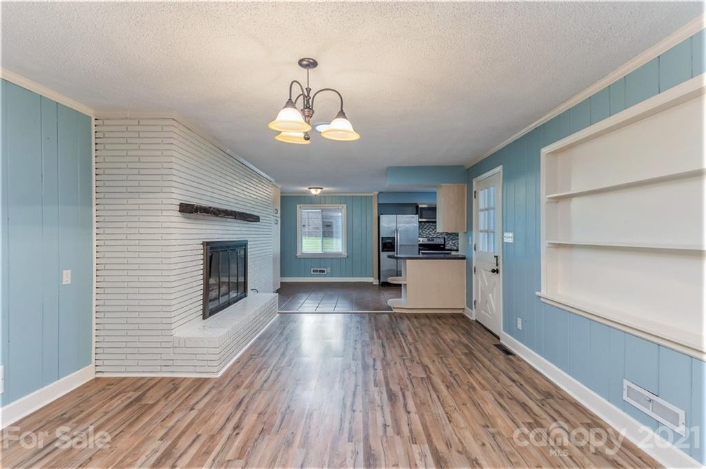 306 Kimmswick Road Charlotte, NC 28214 - Photo 8 of 21 a view of a kitchen with wooden floor and a sink