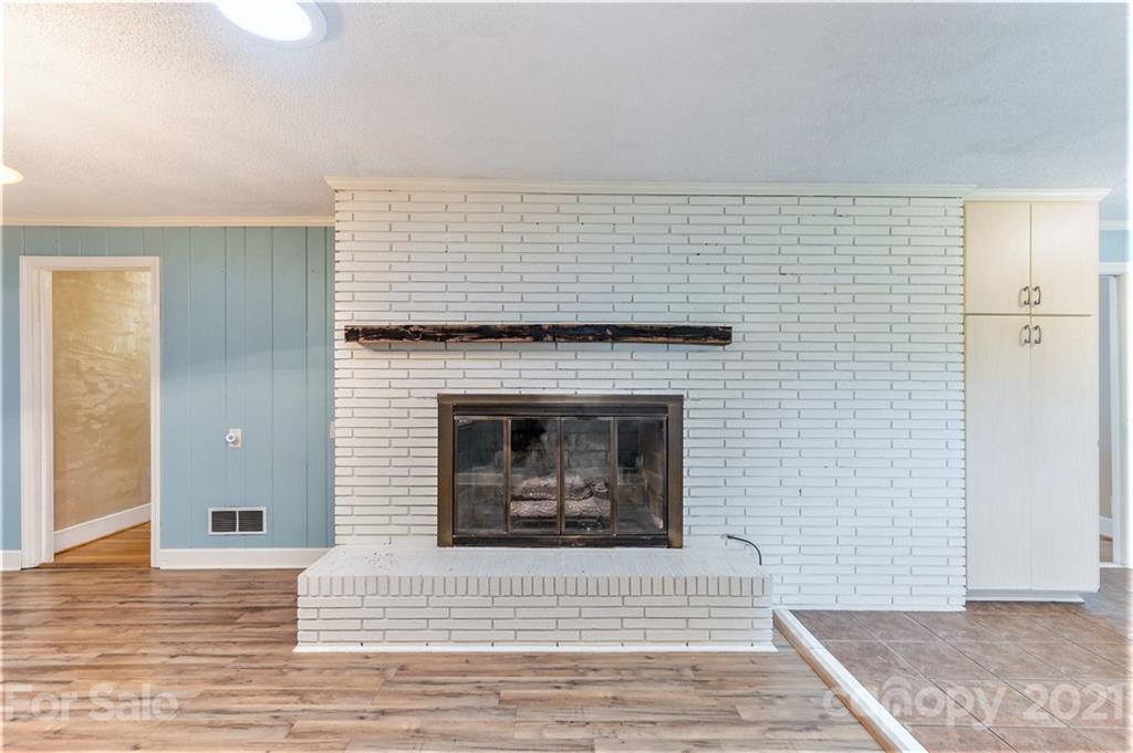 306 Kimmswick Road Charlotte, NC 28214 - Photo 9 of 21 a view of a livingroom with a fireplace