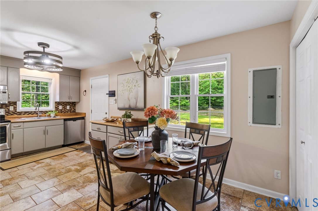 2869 Newville Road Disputanta, VA 23842 - Photo 10 of 26 Kitchen and dining area featuring tile flooring, l