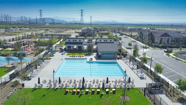 a view of a swimming pool with an outdoor seating