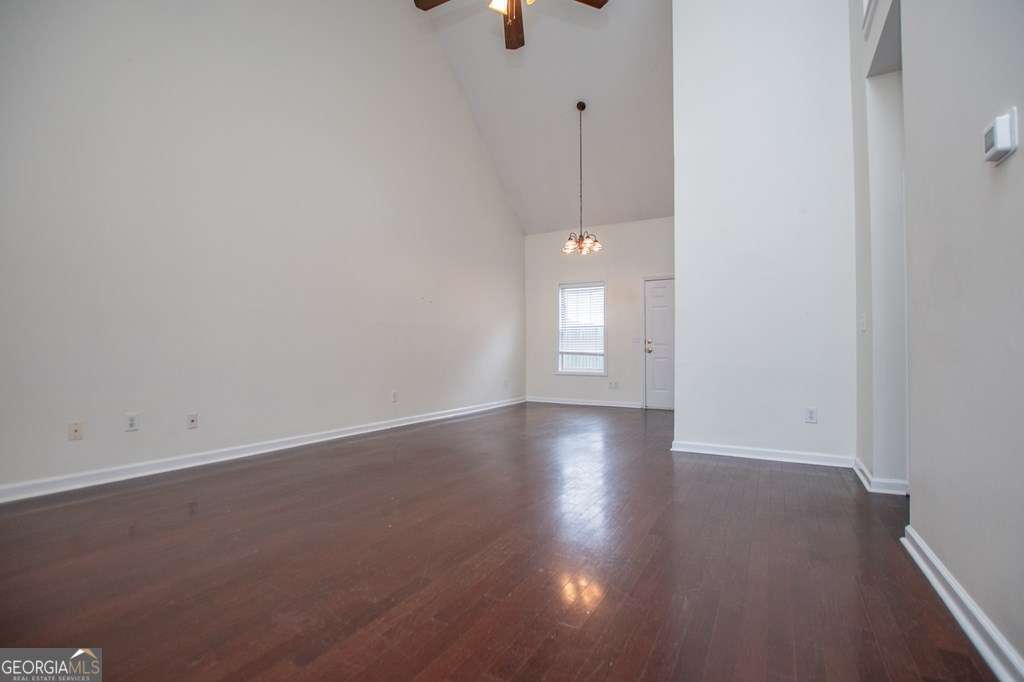 255 Morgan Road Carrollton, GA 30116 - Photo 11 of 57 an empty room with wooden floor and windows