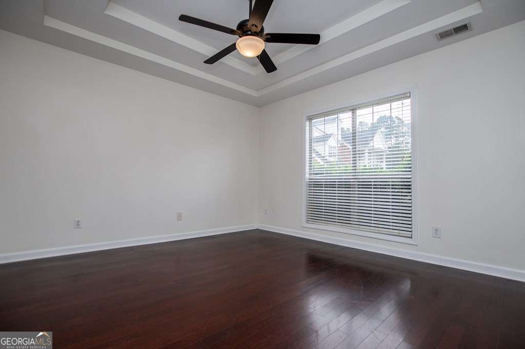 255 Morgan Road Carrollton, GA 30116 - Photo 27 of 57 an empty room with wooden floor and windows