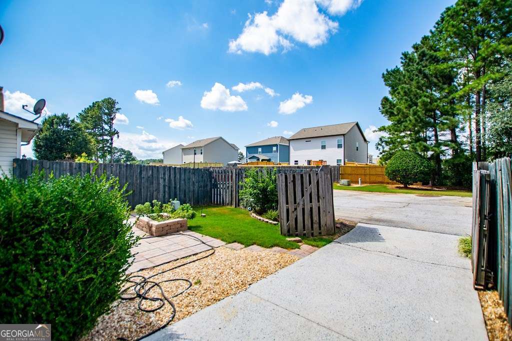 255 Morgan Road Carrollton, GA 30116 - Photo 53 of 57 a view of a house with garden and pathway