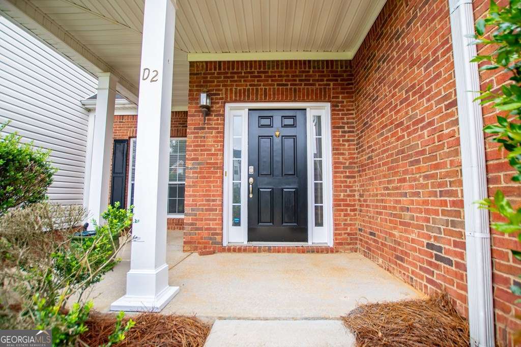255 Morgan Road Carrollton, GA 30116 - Photo 7 of 57 a front view of a house with a yard and garage