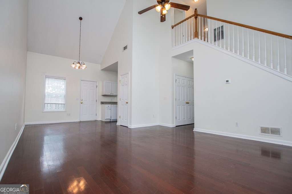 255 Morgan Road Carrollton, GA 30116 - Photo 9 of 57 an empty room with wooden floor and windows
