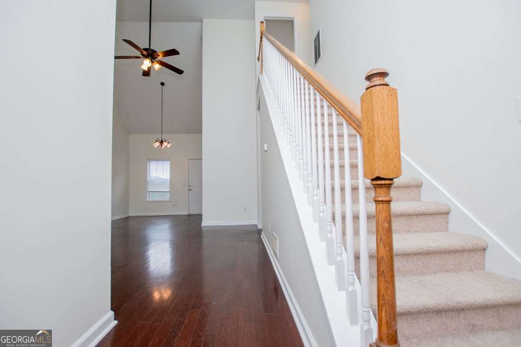 255 Morgan Road Carrollton, GA 30116 - Photo 10 of 57 a view of a hallway with wooden floor and staircase
