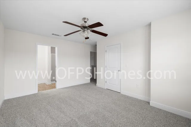 a view of empty room with windows