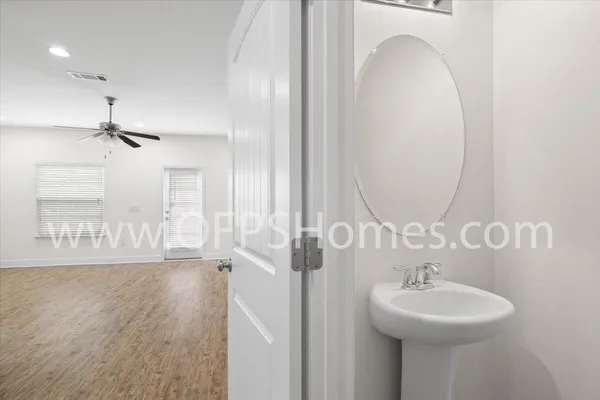 a bathroom with a sink a mirror and shower