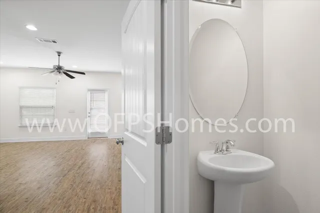 a bathroom with a sink a mirror and shower