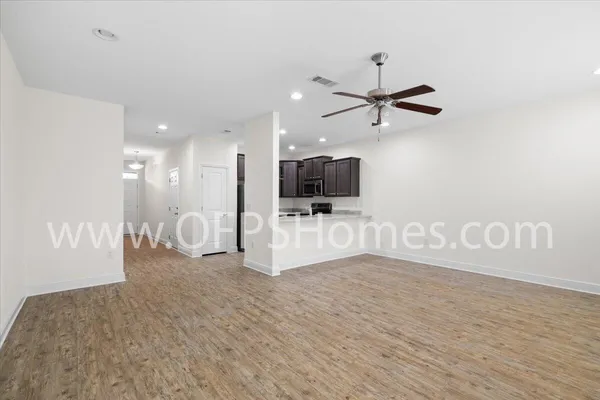 a view of kitchen with furniture and flat screen tv