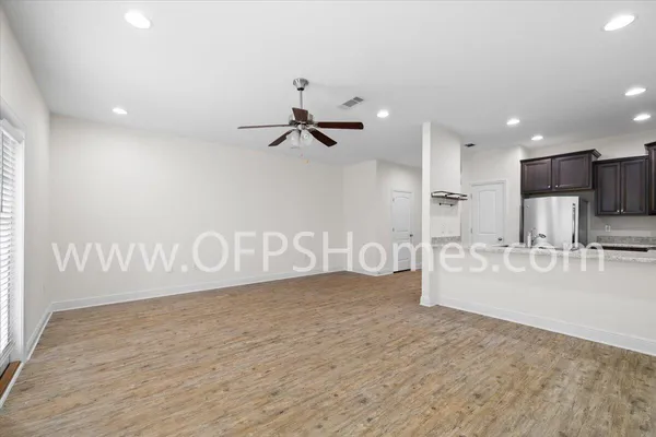 a view of kitchen cabinet and microwave