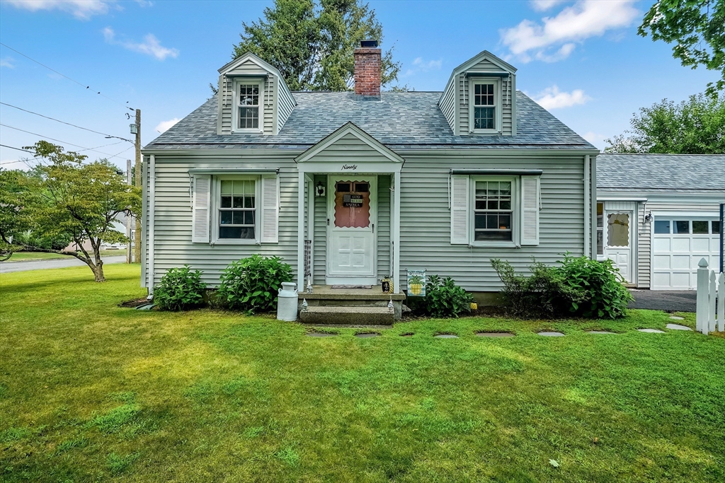 90 Roanoke Road Springfield, MA 01118 - Photo 1 of 19 a front view of a house with a yard