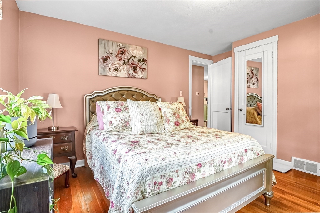 90 Roanoke Road Springfield, MA 01118 - Photo 10 of 19 a bedroom with a bed and a painting on the wall