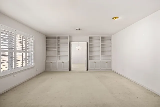 an empty room with a empty shelves