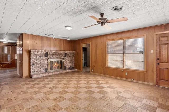 a view of an empty room with a fireplace