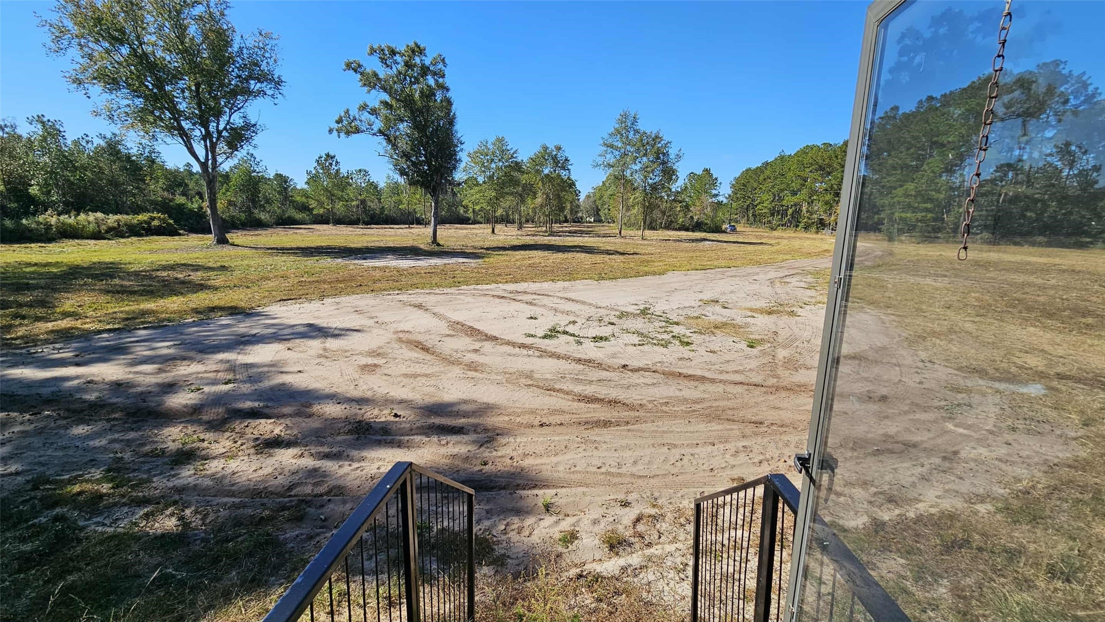 17539 Hodges Road Hilliard, FL 32046 - Photo 3 of 19 a view of a yard with palm tree