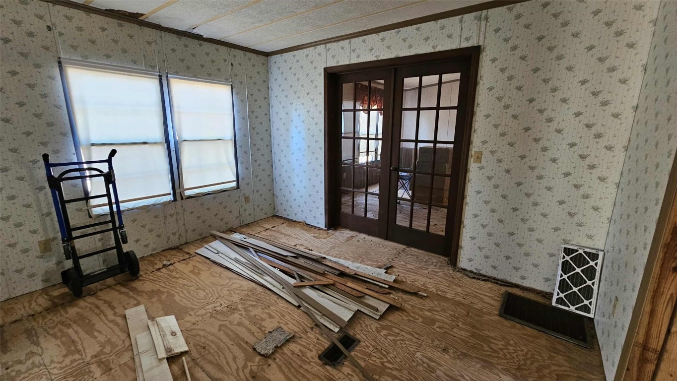 17539 Hodges Road Hilliard, FL 32046 - Photo 42 of 62 a bedroom with a bed and wooden floor