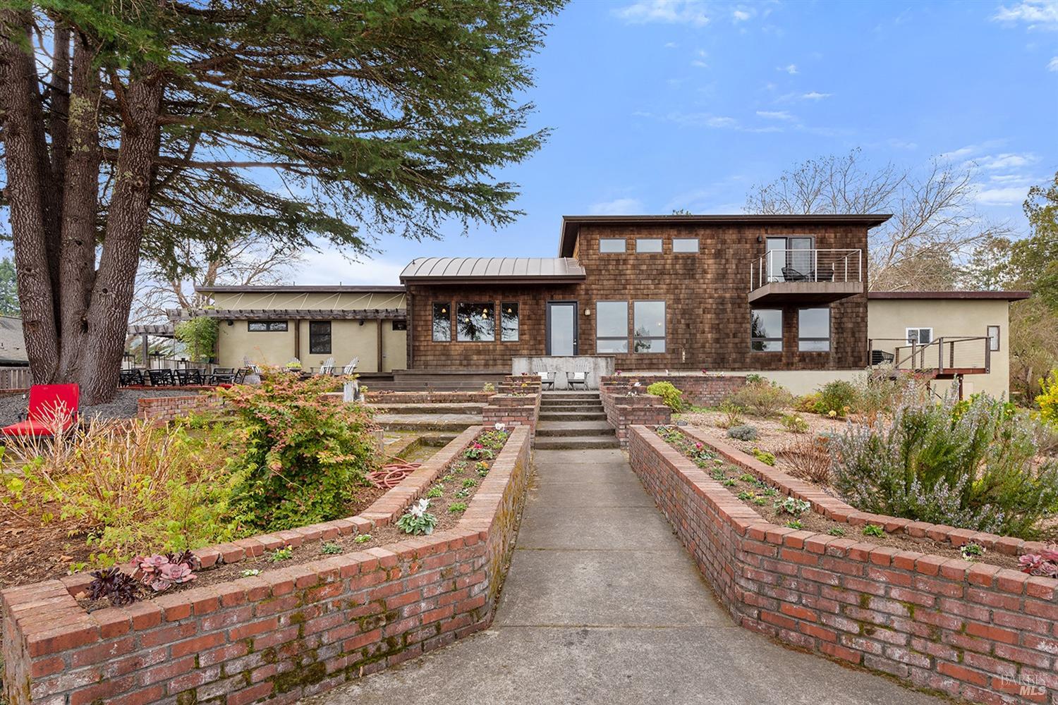 9817 Mill Station Road Sebastopol, CA 95472 - Photo 1 of 1 a view of a house with backyard and sitting area
