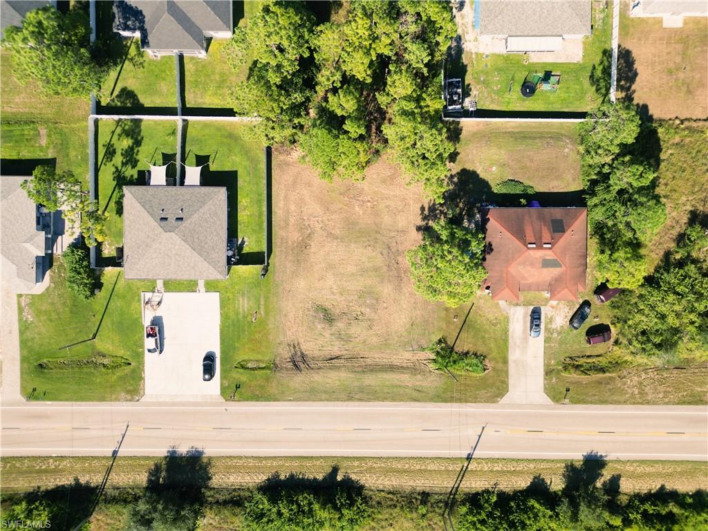 4528 Leonard Boulevard South Lehigh Acres, FL 33973 - Photo 7 of 10 an aerial view of a house with a garden and pathway