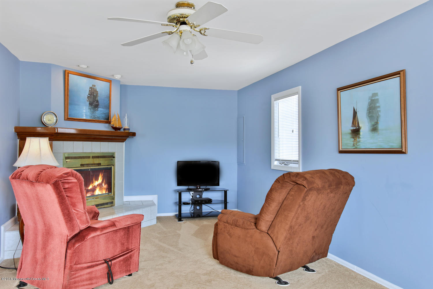 722 Drum Point Road Brick, NJ 08723 - Photo 13 of 28 a living room with furniture and a fireplace