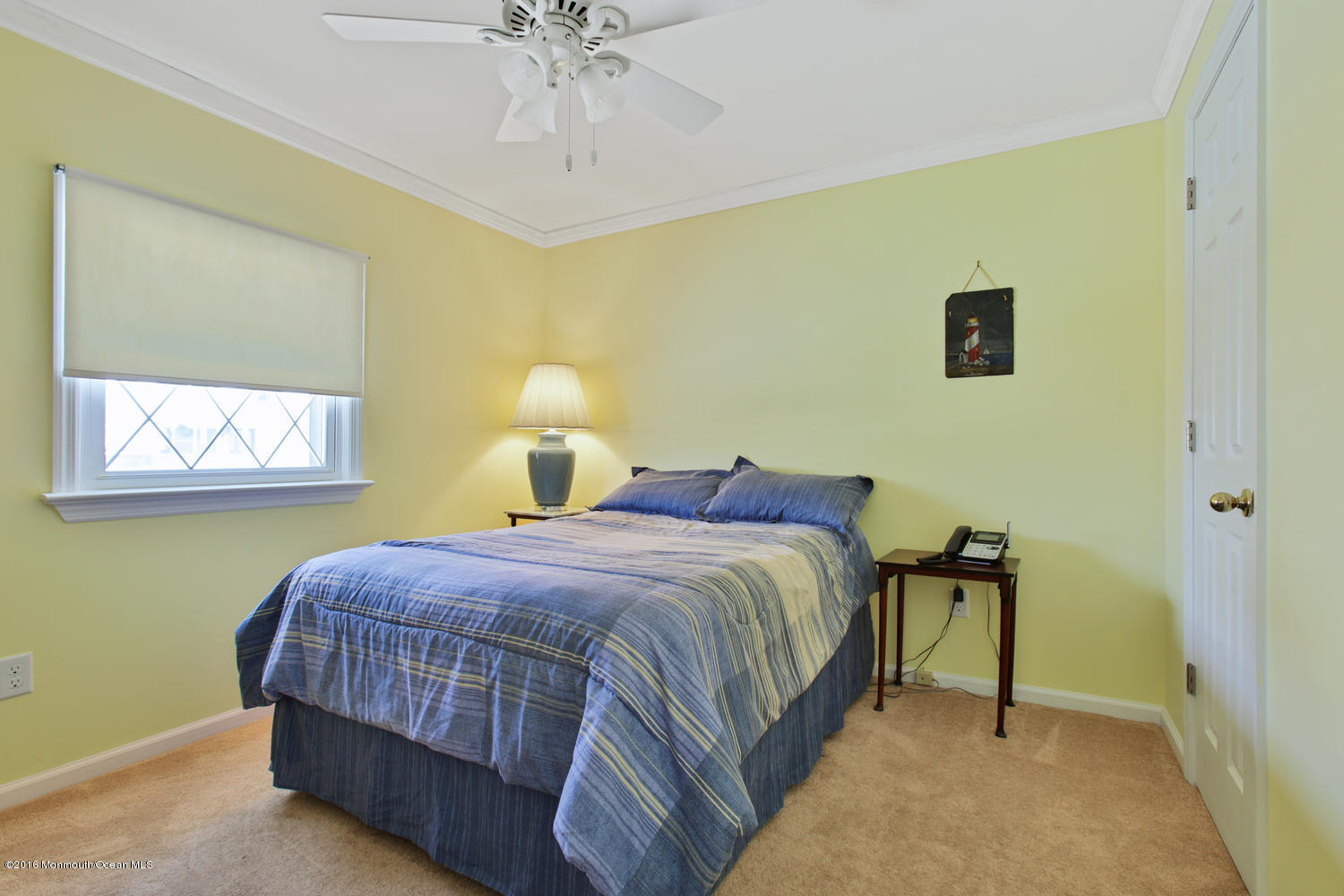 722 Drum Point Road Brick, NJ 08723 - Photo 14 of 28 a bedroom with a bed and a chandelier