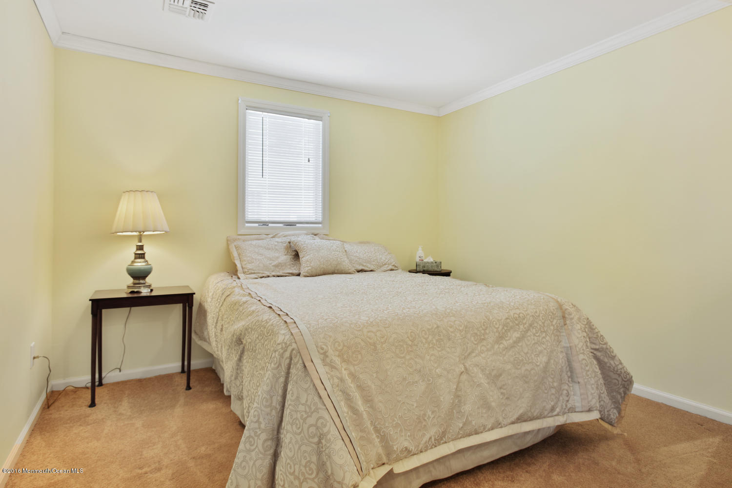 722 Drum Point Road Brick, NJ 08723 - Photo 15 of 28 a bedroom with a bed and a night stand